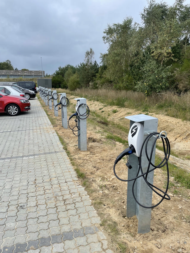 Charging points for a number of electric cars at the parking area of Haarup.