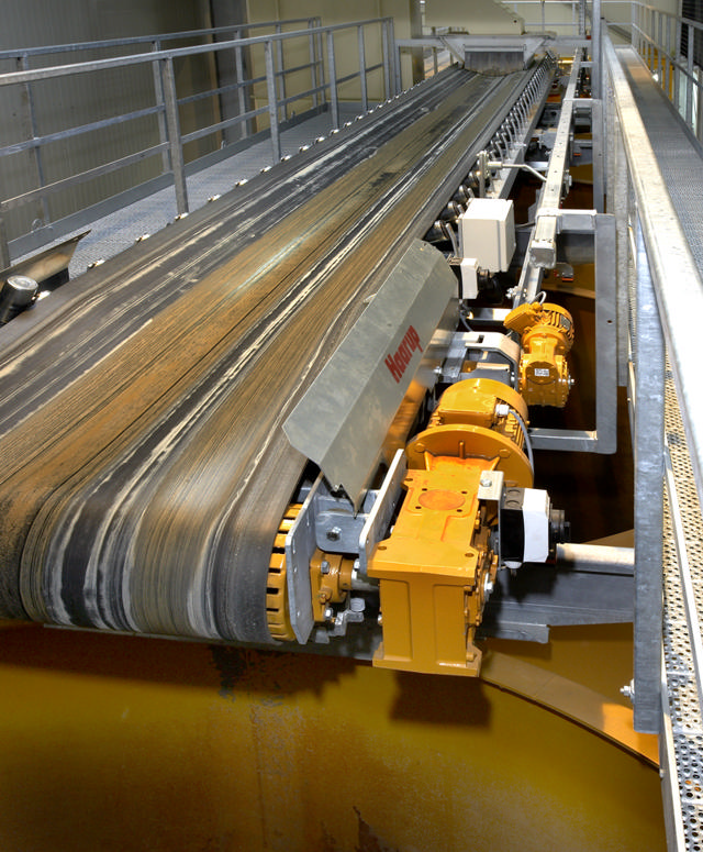 Showing the full length of a belt conveyor.