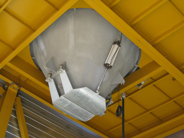 Grey concrete holding hopper seen from below.