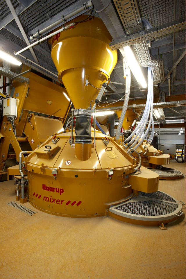 Cement weigh hopper installed on a concrete mixer in a factory.