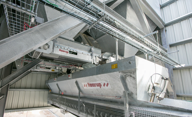 Batching belt shown inside a production facility.