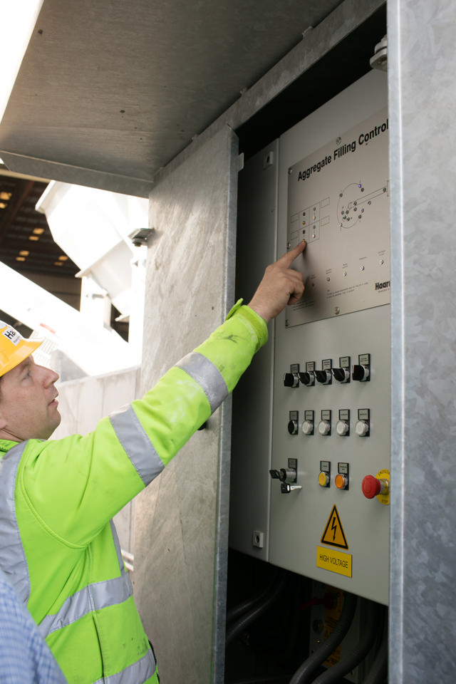 Employee operating the filling control system.