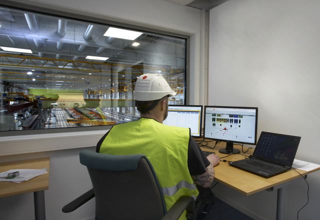 Employee operating the Mixo 5000 control system.