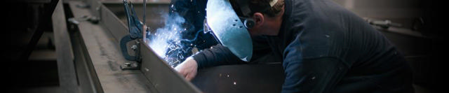 Man welding equipment.
