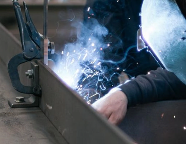 Black smith is welding equipment.